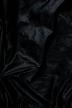 Siyah soyut arka plan kumaşı ve lüks sıvı dalgalar ipek dokusu saten malzeme.