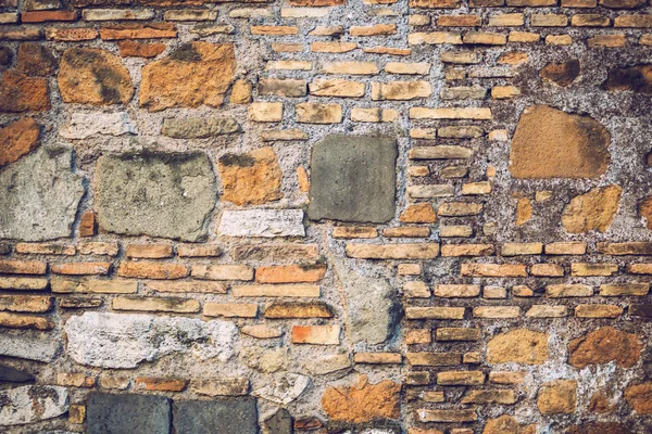 Muro de ladrillo y piedra en Roma, Italia. Textura de fondo — Foto de Stock