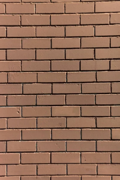 brown painted brick wall. vertical orientation. brick background