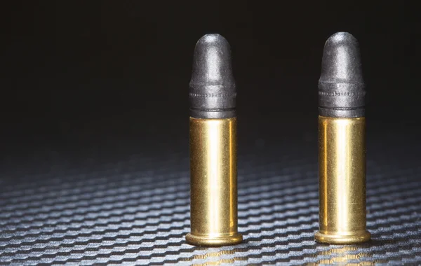 Ammunition on graphite — Stock Photo, Image