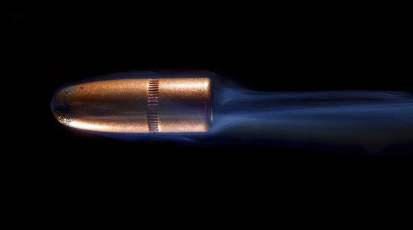Copper bullet and smoke — Stock Photo, Image