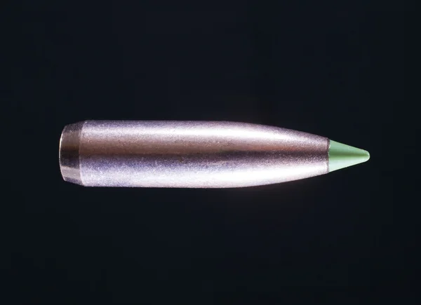 Bullet on black — Stock Photo, Image