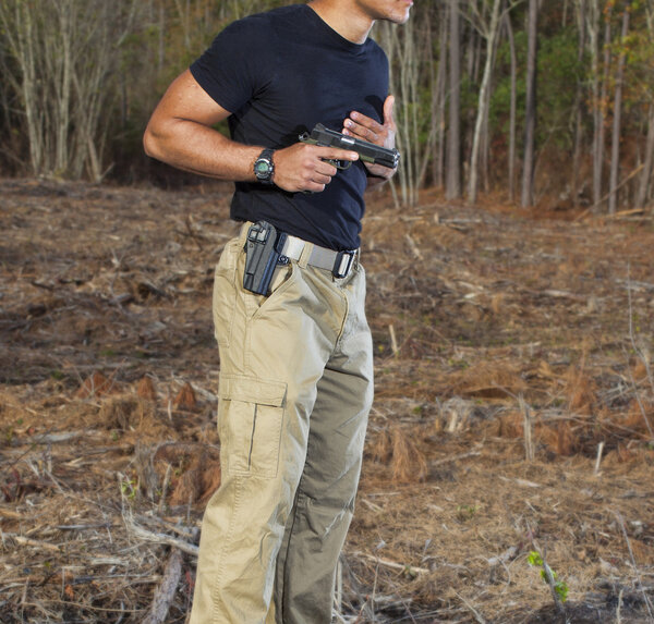 Man drawing a handgun
