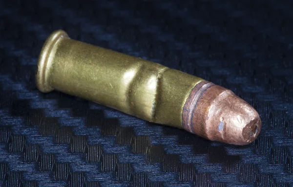 Crooked bullet on graphite — Stock Photo, Image