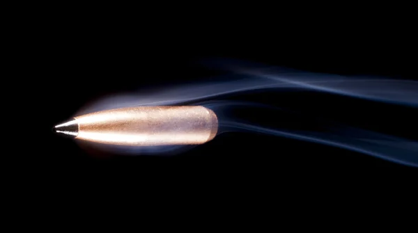 Speeding bullet and smoke — Stock Photo, Image