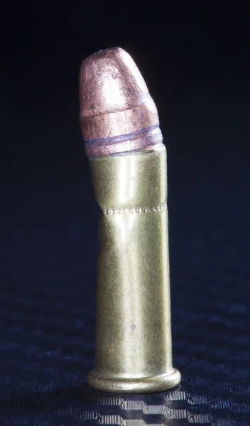Crooked pistool cartridge — Stockfoto