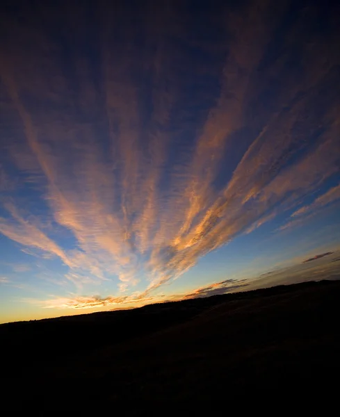 Wyoming atardecer con nubes anaranjadas — Foto de Stock