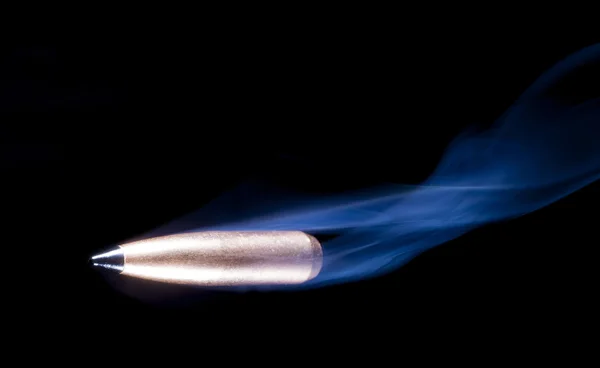 Plastic tipped bullet and smoke — Stock Photo, Image