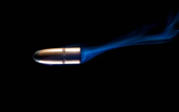 Smoke behind a copper plated bullet — Stock Photo, Image