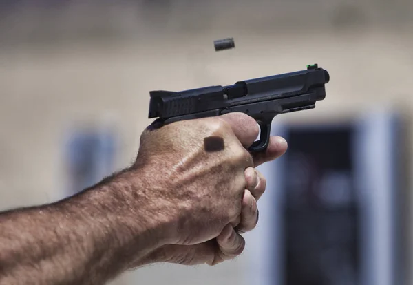 Handgun being shot — Stock Photo, Image