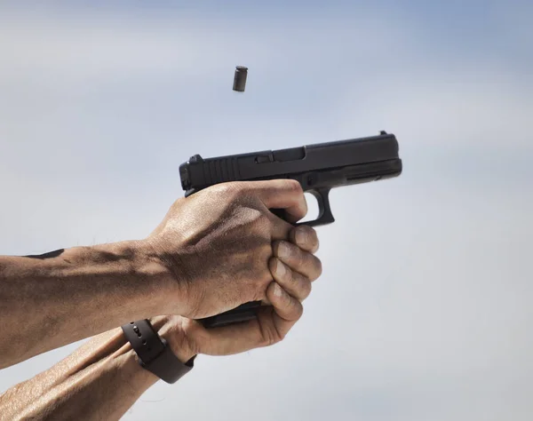 Handgun being shot — Stock Photo, Image