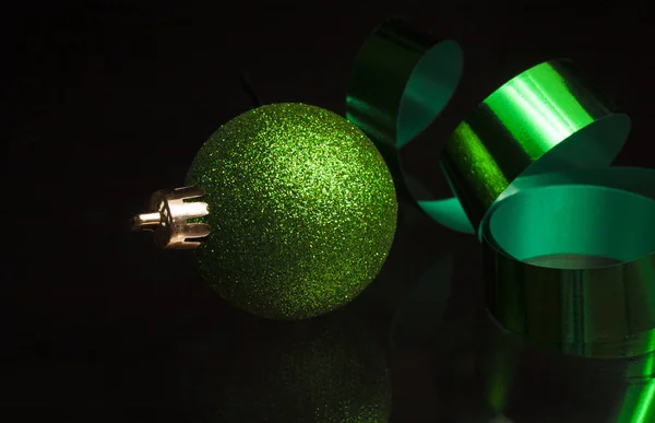 Green Christmas ornament and ribbon — Stock Photo, Image