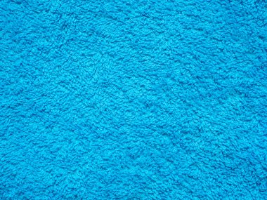 Açık mavi tekstil dokusu, arka plan ve duvar kağıdının yakın çekimi. Mavi örgü kumaş dokusu. Tüylü havlunun yüzeyi. Mavi kumaş kumaş döşeme mobilyası. Yüksek kaliteli makro.