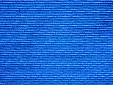 Mavi tekstil dokusunun, arka planının ve duvar kağıdının yakın çekimi. Mobilyaların mavi kumaş döşeme dokusu. Yüksek kaliteli makro fotoğrafçılık.