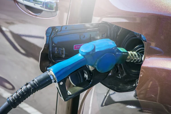 Close-up fuel nozzle. Fill up fuel at gas station — Stock Photo, Image