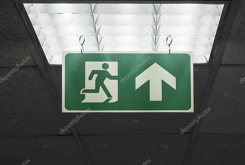 Green emergency exit sign  hang on the ceiling
