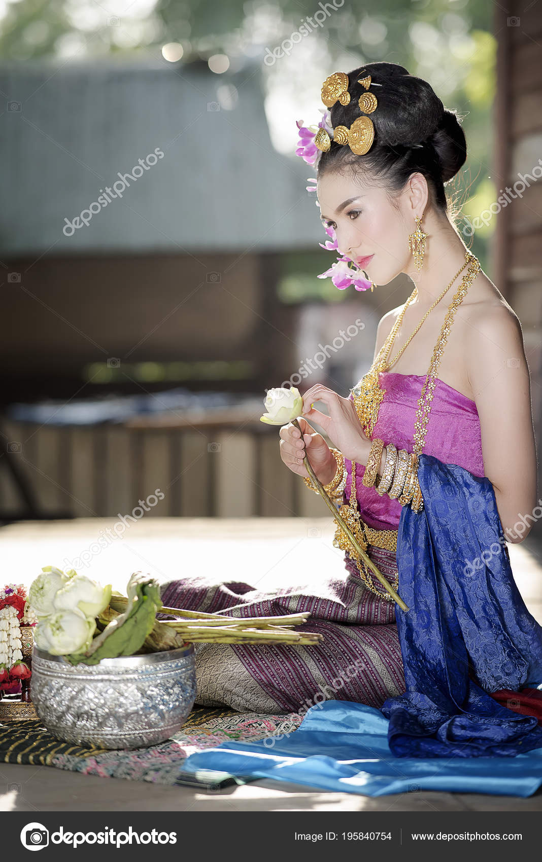 https://st3.depositphotos.com/3506113/19584/i/1600/depositphotos_195840754-stock-photo-young-beautiful-woman-thai-traditional.jpg