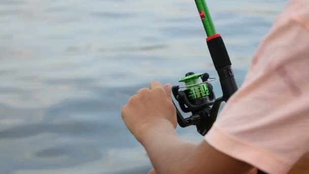 Man Child Fisherman Sits Parapet Sea Catches Fish Fishing Rod — Stock Video