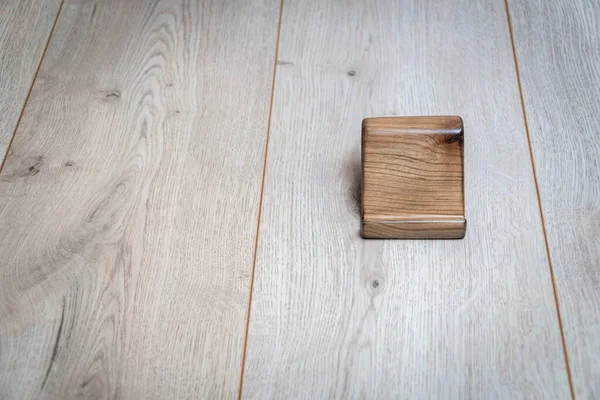 Wooden stand for phone on a wooden background