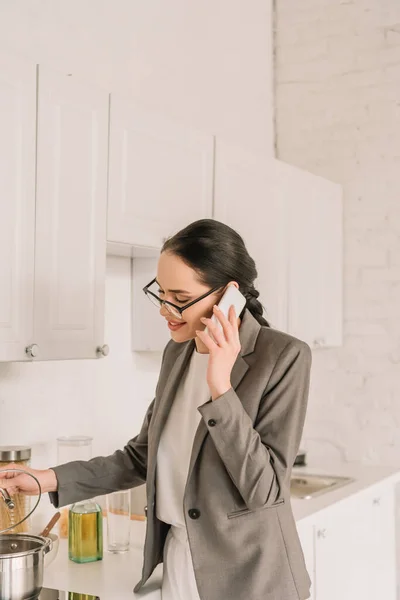 Smiling Businesswoman Blazer Pajamas Cooking Talking Smartphone Kitchen — Stock Photo, Image