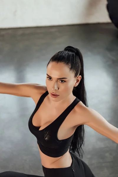 High angle view of sportswoman with outstretched hands in gym — Stock Photo