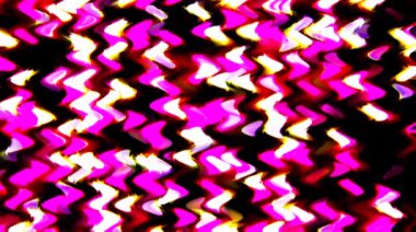 Siyah arkaplanda renkli çizgilerle ince hareketleri düzenleyen parlak bir ışık.