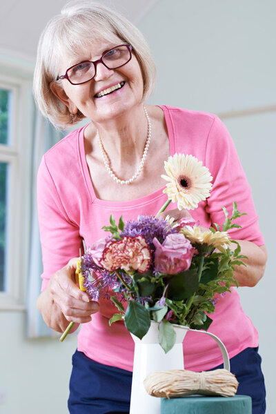 Senior Woman In Flower Arranging Class
