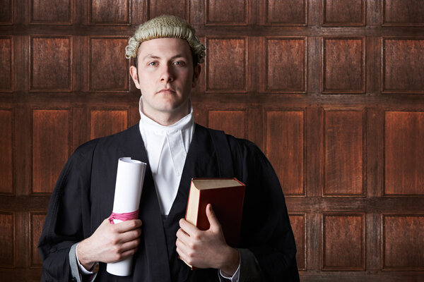 Portrait Of Lawyer In Court Holding Brief And Book