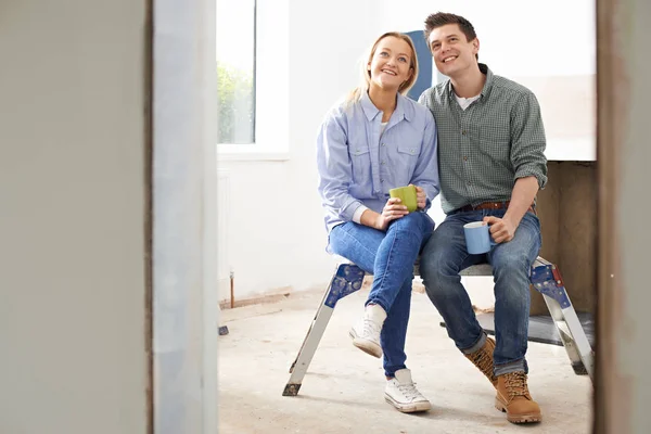 Couple Sitting In Property Being Rennovated — Stock Photo, Image