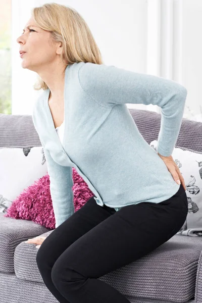 Mature Woman Suffering From Backache At Home — Stock Photo, Image