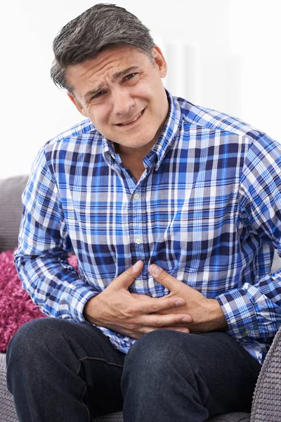 Mature Man Suffering From Stomach Pain At Home — Stock Photo, Image