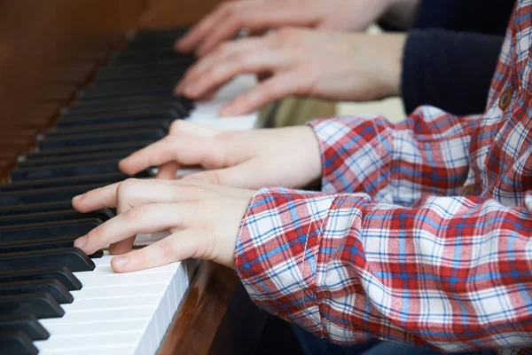 Close Up Of Boy Playing Piano Duet With Teacher — Stock Photo, Image