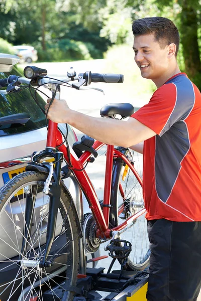 Male Cyclist Taking Mountain Bike From Rack On Car — Stock Photo, Image