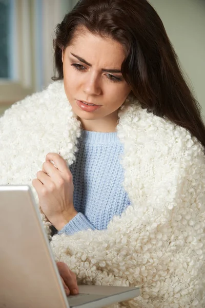 Ill Woman Looking Up Symptoms On Computer