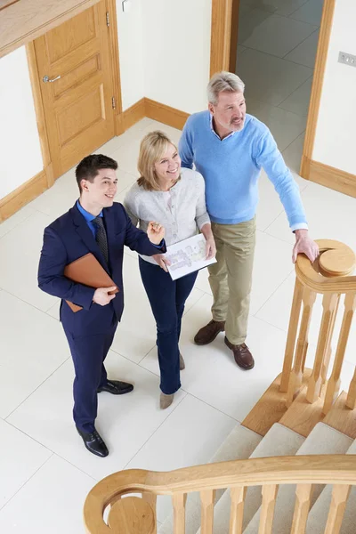 Realtor Showing Mature Couple Around House For Sale — Stock Photo, Image