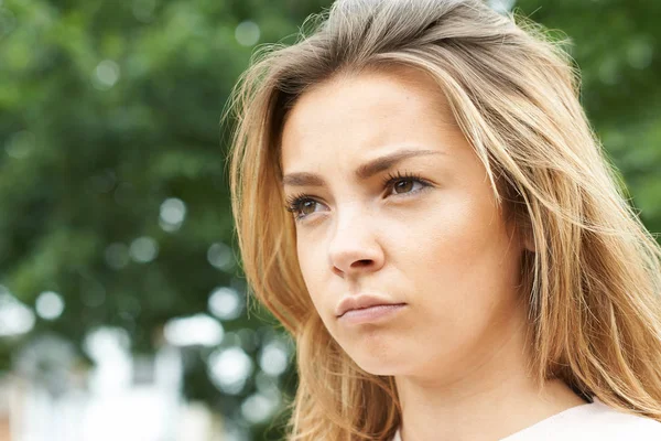 Outdoor Head And Shoulders Shot Of Serious Teenage Girl — Stock Photo, Image