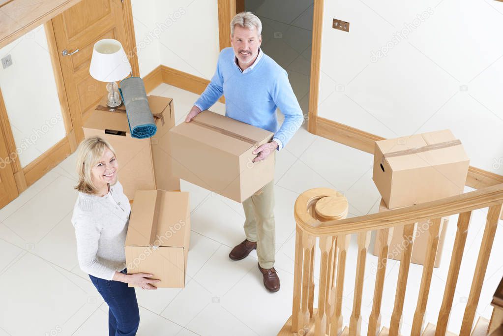 Mature Couple Moving In To New Home 