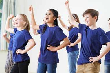 Group Of Children Enjoying Drama Class Together clipart