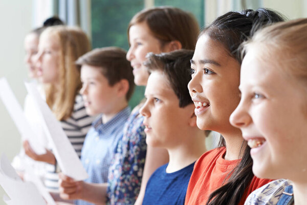 Group Of Children Enjoying Singing Group