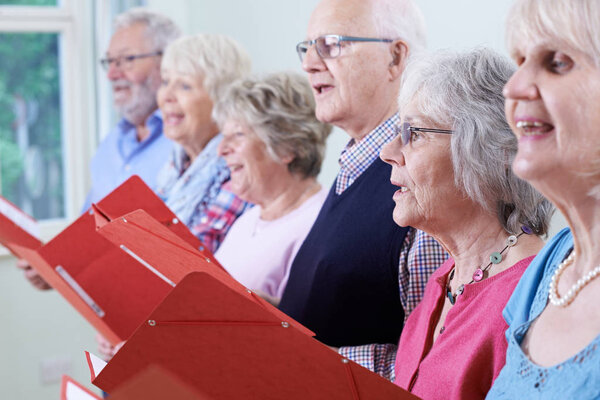 Group Of Seniors Singing In Choir Together