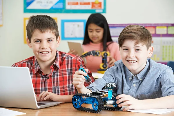 Pupils In Science Lesson Studying Robotics