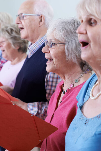 Group Of Seniors Singing In Choir Together