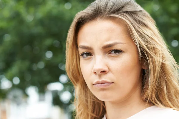 Outdoor Head And Shoulders Portrait Of Serious Teenage Girl — Stock Photo, Image