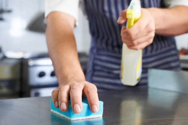 Close Up Of Worker In Restaurant Kitchen Cleaning Down After Ser — Stock Photo, Image