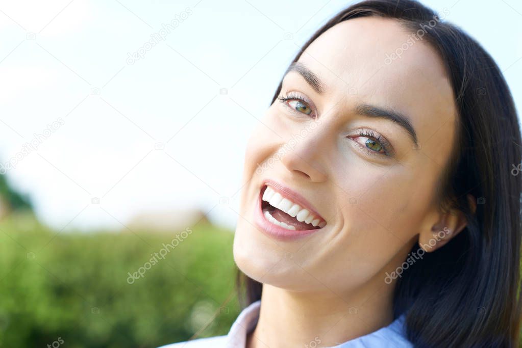 Outdoor Portrait Of Woman With Perfect Teeth And Beautiful Smile