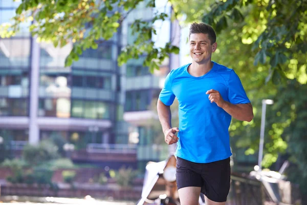 Man Running By River  In Urban Setting — Stock Photo, Image