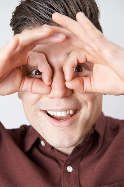 Studio Shot Of Man Making Spectacle Shape With His Hands — Stock Photo, Image