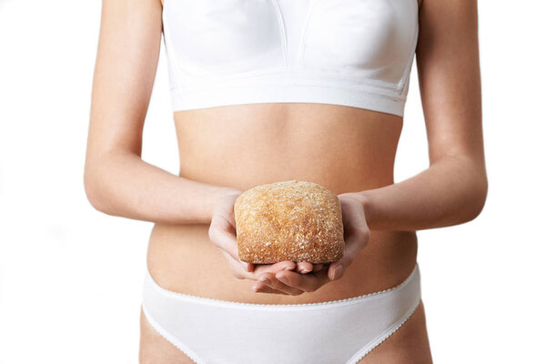 Close Up Of Woman Wearing Underwear Holding Bread Roll