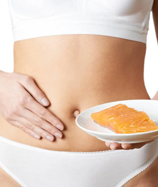 Close Up Of Woman In Underwear Plate Of Salmon And Touching Stom — Stock Photo, Image