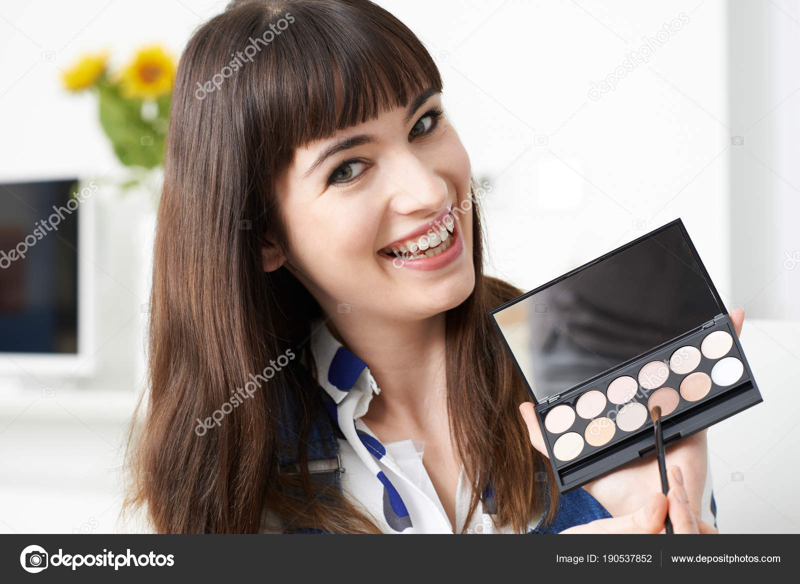 Female Vlogger Presenting Make Up Tutorial Video Stock Photo